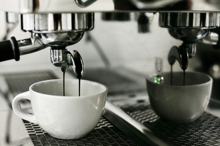 Black and white espresso coffee brewing