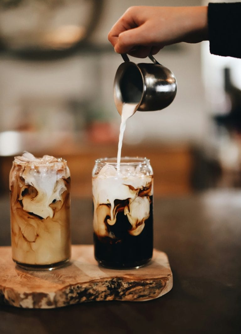 Cold Brew Coffee with Milk Pouring